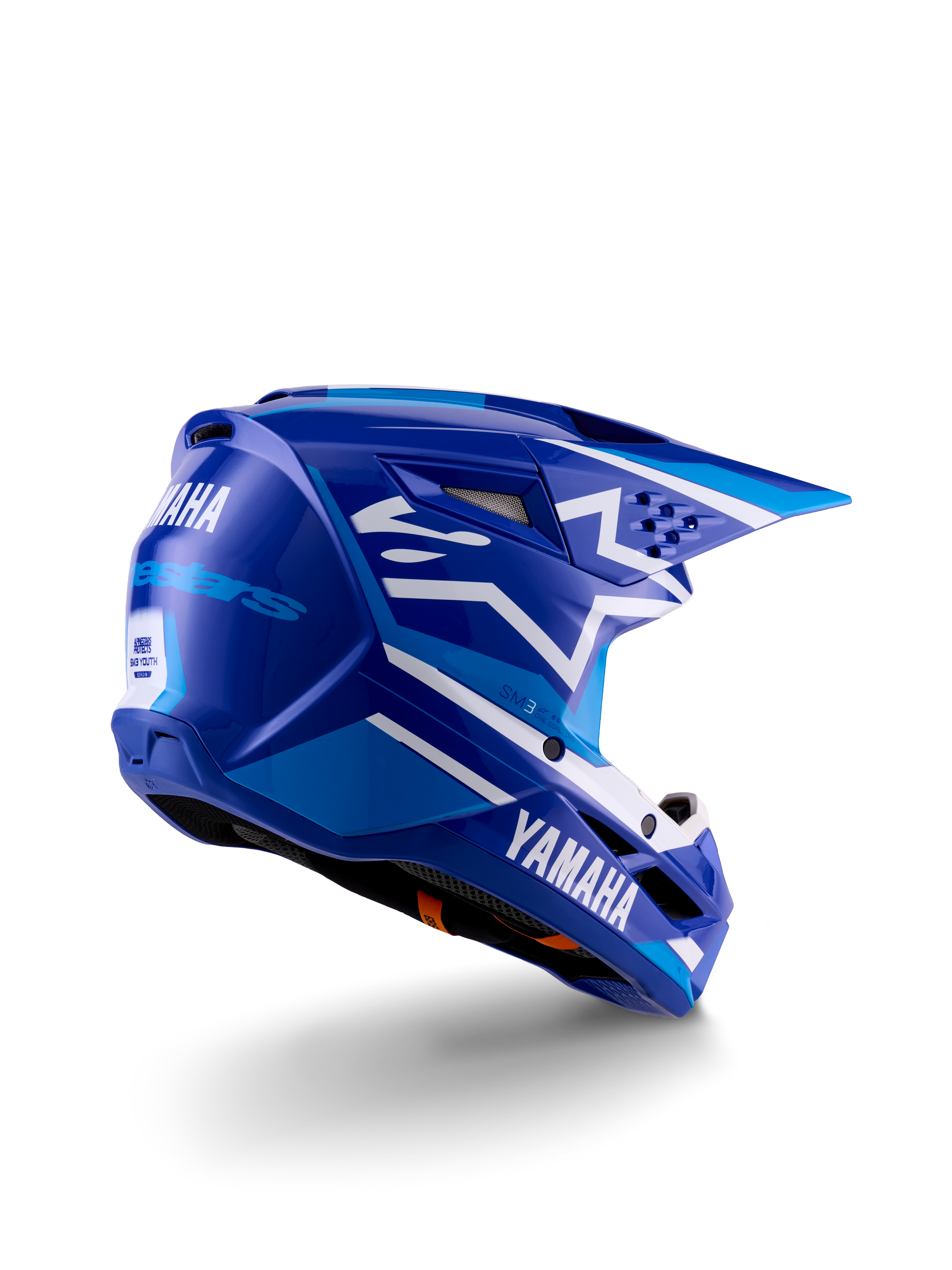 Capacete de motocross Alpinestars Yamaha S-M3 para jovens, azul e branco brilhante, com a marca Yamaha em destaque na lateral e na parte traseira, design aerodinâmico com ventilação posterior, proteção de cabeça para todo-o-terreno numa vista traseira de três quartos