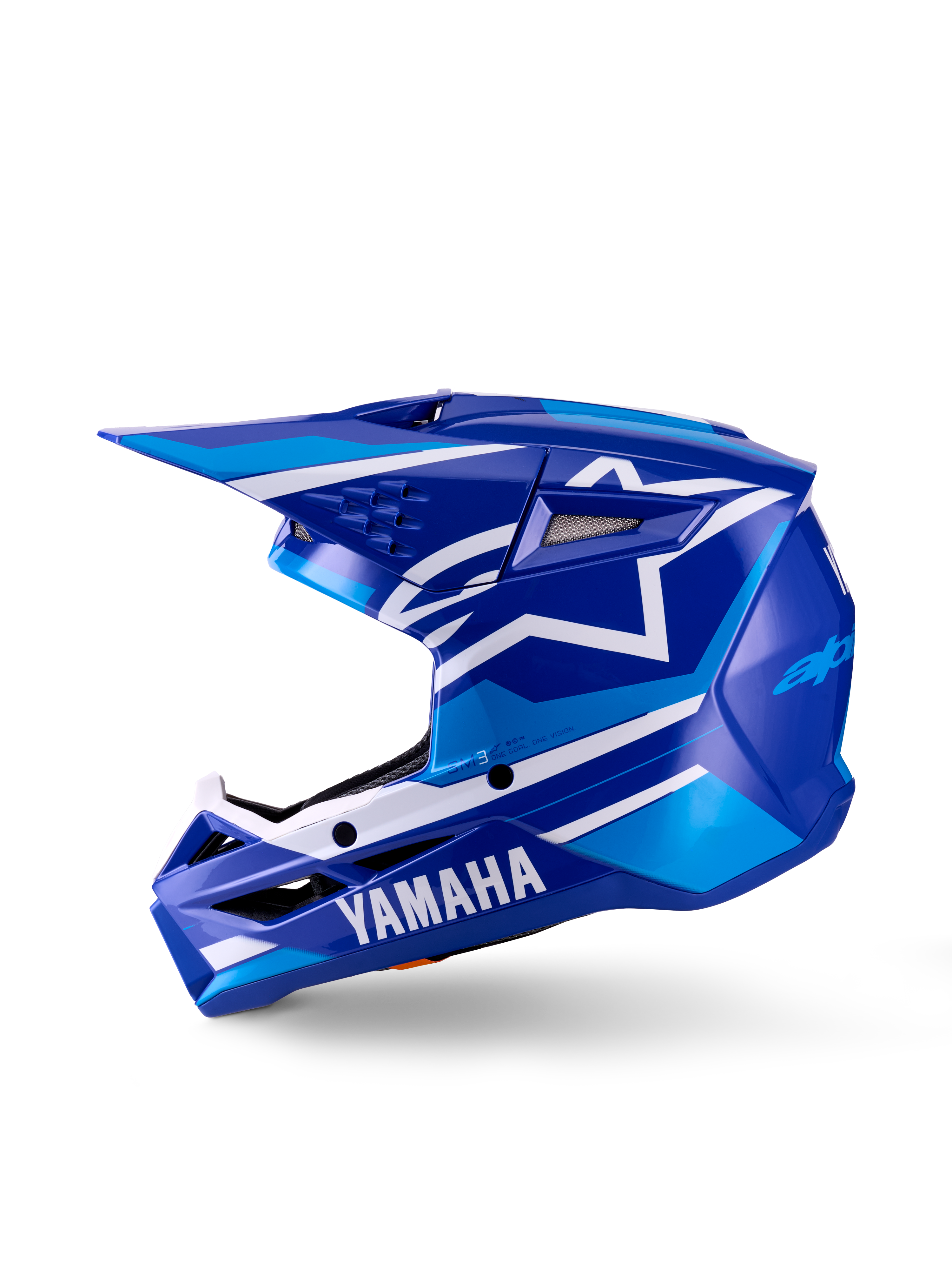 Capacete de Motocross Yamaha S-M3 para Jovens, capacete de motocross, azul e branco brilhante, vista de perfil lateral, com a marca Yamaha em destaque na proteção de queixo e o logótipo da estrela da Alpinestars, calota aerodinâmica elegante com múltiplas entradas de ventilação e viseira integrada.