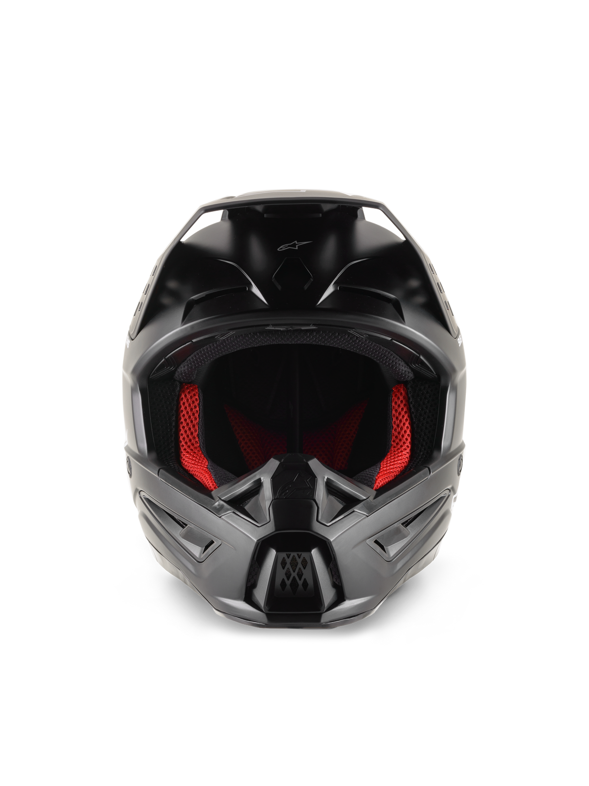 Capacete Alpinestars S-M5 Solid, capacete de motocross, preto mate, vista frontal com forro interior vermelho, proteção de queixo esculpida com aberturas de ventilação e viseira protetora para competição todo-o-terreno