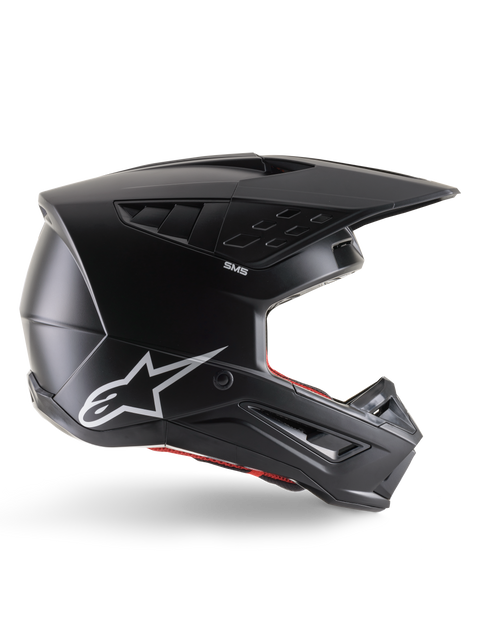 Capacete Alpinestars S-M5 Solid, capacete de motocross, preto mate com logótipo da estrela Alpinestars em branco e forro interior vermelho, design aerodinâmico com várias aberturas de ventilação e viseira longa, proteção todo-o-terreno com certificação ECE 22.06