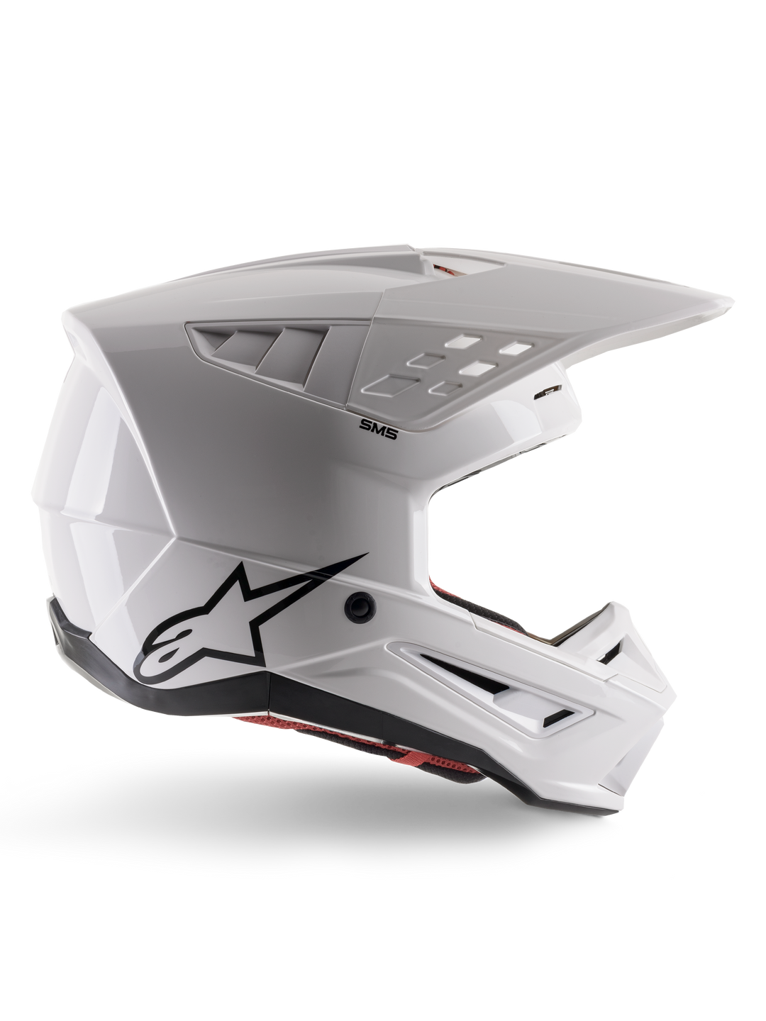 Alpinestars S-M5 Solid Helmet ECE 22.06, capacete de motocross, branco brilhante, perfil lateral com design aerodinâmico angular, viseira proeminente, entradas de ar integradas, logótipo Astars preto na parte traseira e acolchoamento interior vermelho visível