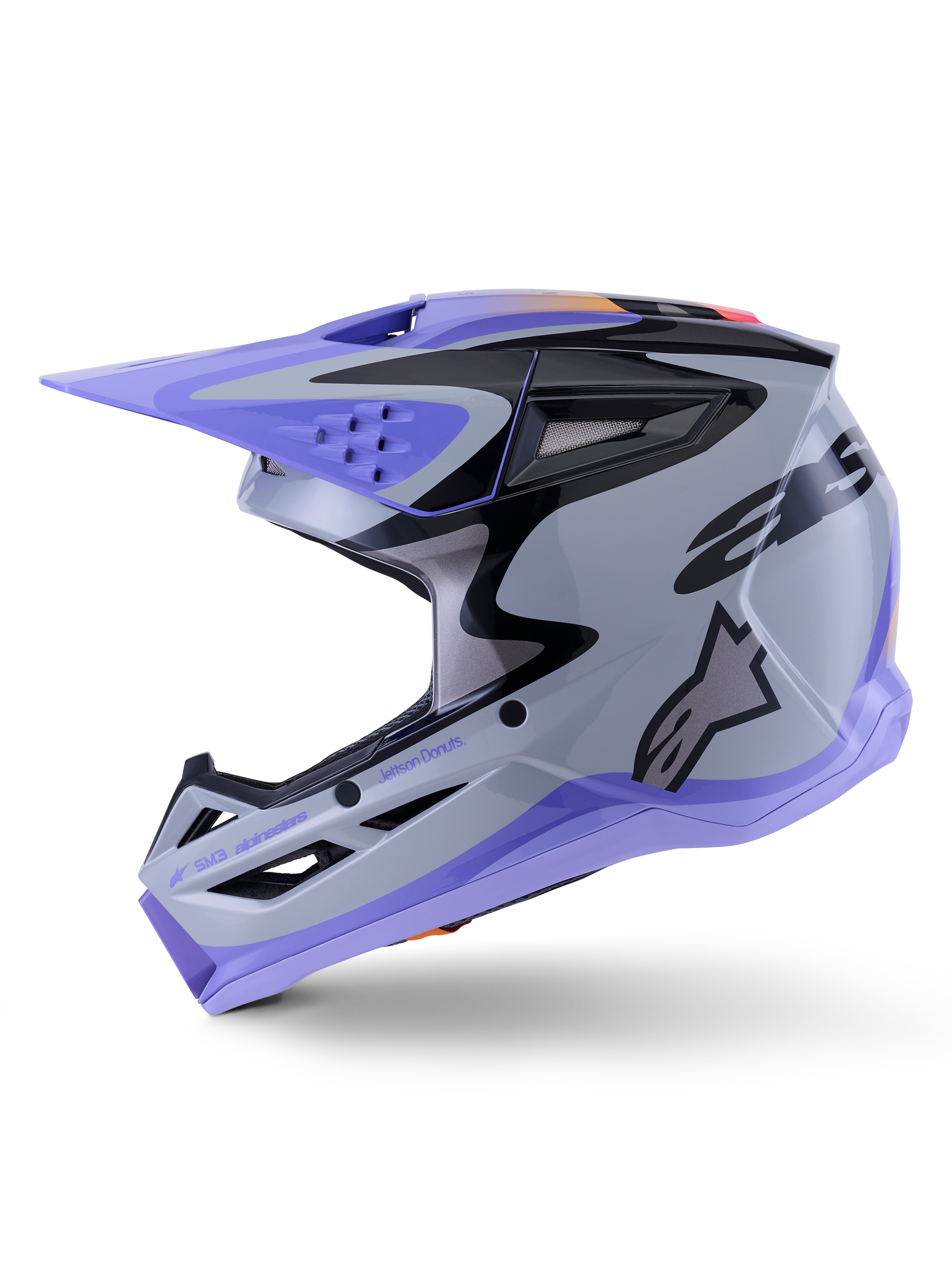 Capacete Alpinestars S-M3 Jettson, capacete de motocross, cinzento, roxo e preto brilhante, vista de perfil lateral com gráficos elegantes e viseira ajustável, com várias aberturas de ventilação e a marca Alpinestars, proteção off-road de alto desempenho