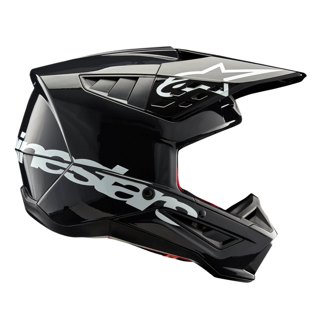 Alpinestars S-M5 Corp Helmet, Motocross Helmet, Dark Gray Glossy, side profile view with large white Alpinestars logo, white star logo on the visor, sleek aerodynamic vents, glossy finish, off-road racing protection