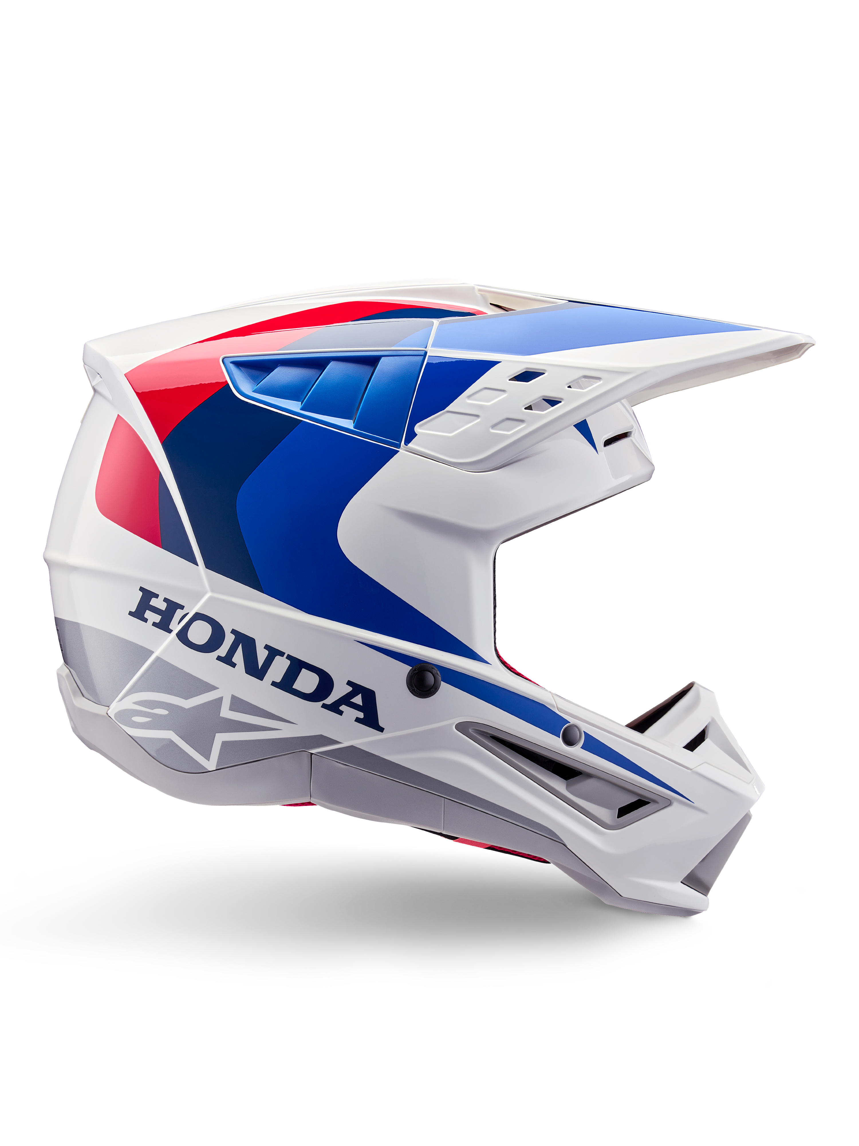 Alpinestars Honda S-M5 Helmet ECE, capacete de motocross, branco, azul e vermelho, vista de perfil lateral, design aerodinâmico com viseira integrada, múltiplas aberturas de ventilação, acabamento brilhante, marca Honda em destaque e logótipo Alpinestars