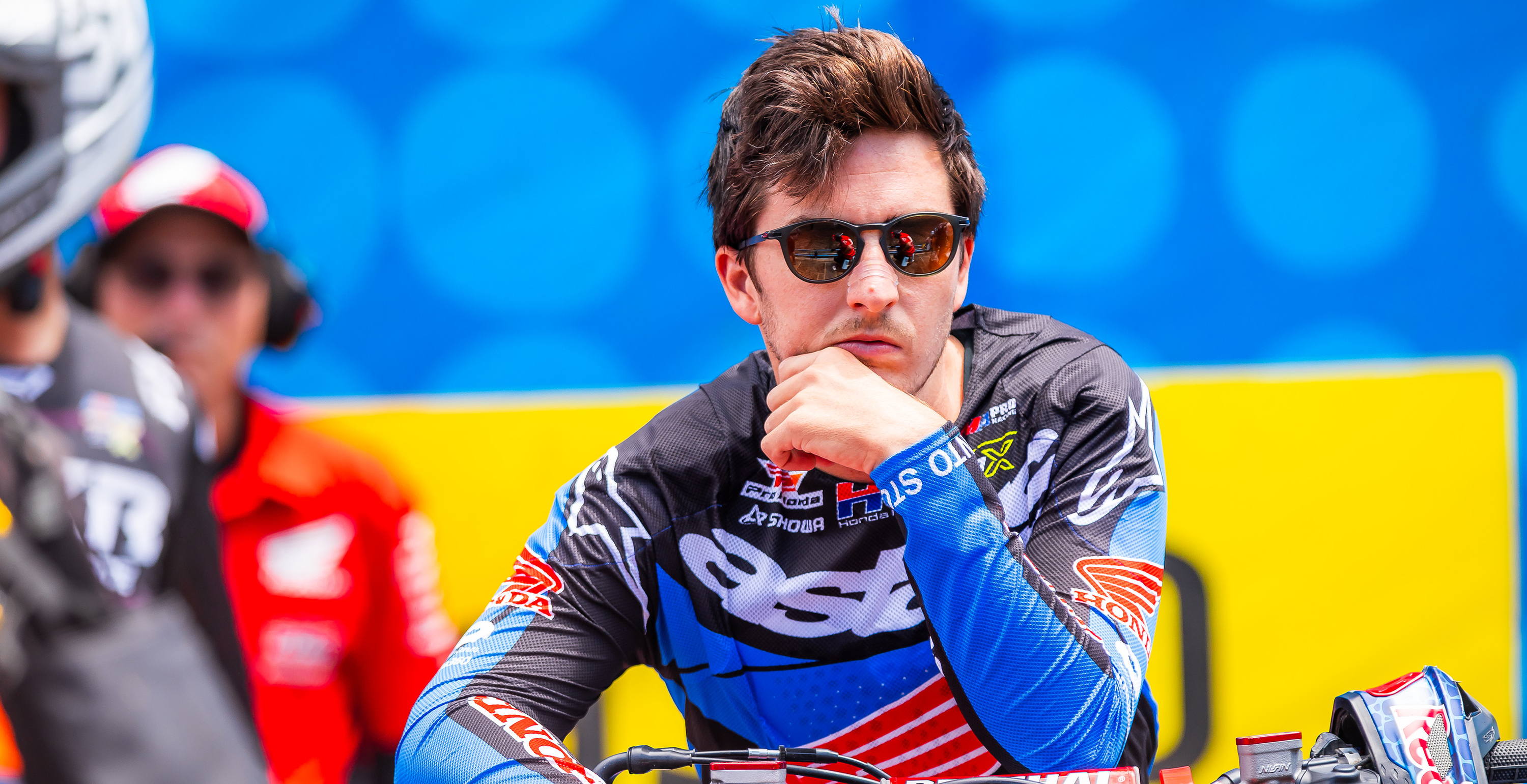 Hunter Lawrence wearing an Alpinestars motocross jersey against a blue and yellow background