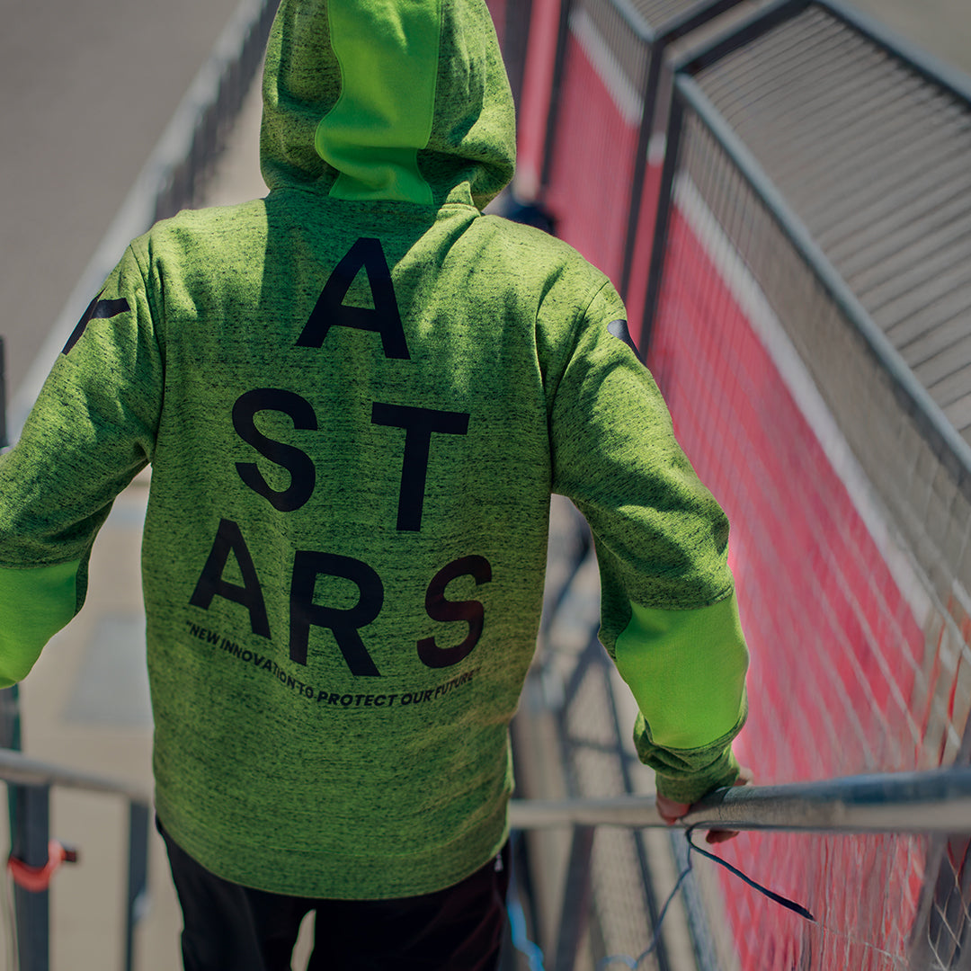 Alpinestars Perpetuate Hoodie, vista traseira, lã mesclada em verde lima, grande gráfico de texto ASTARS preto nas costas, roupa desportiva casual com blocos de tecido e capuz com cordão