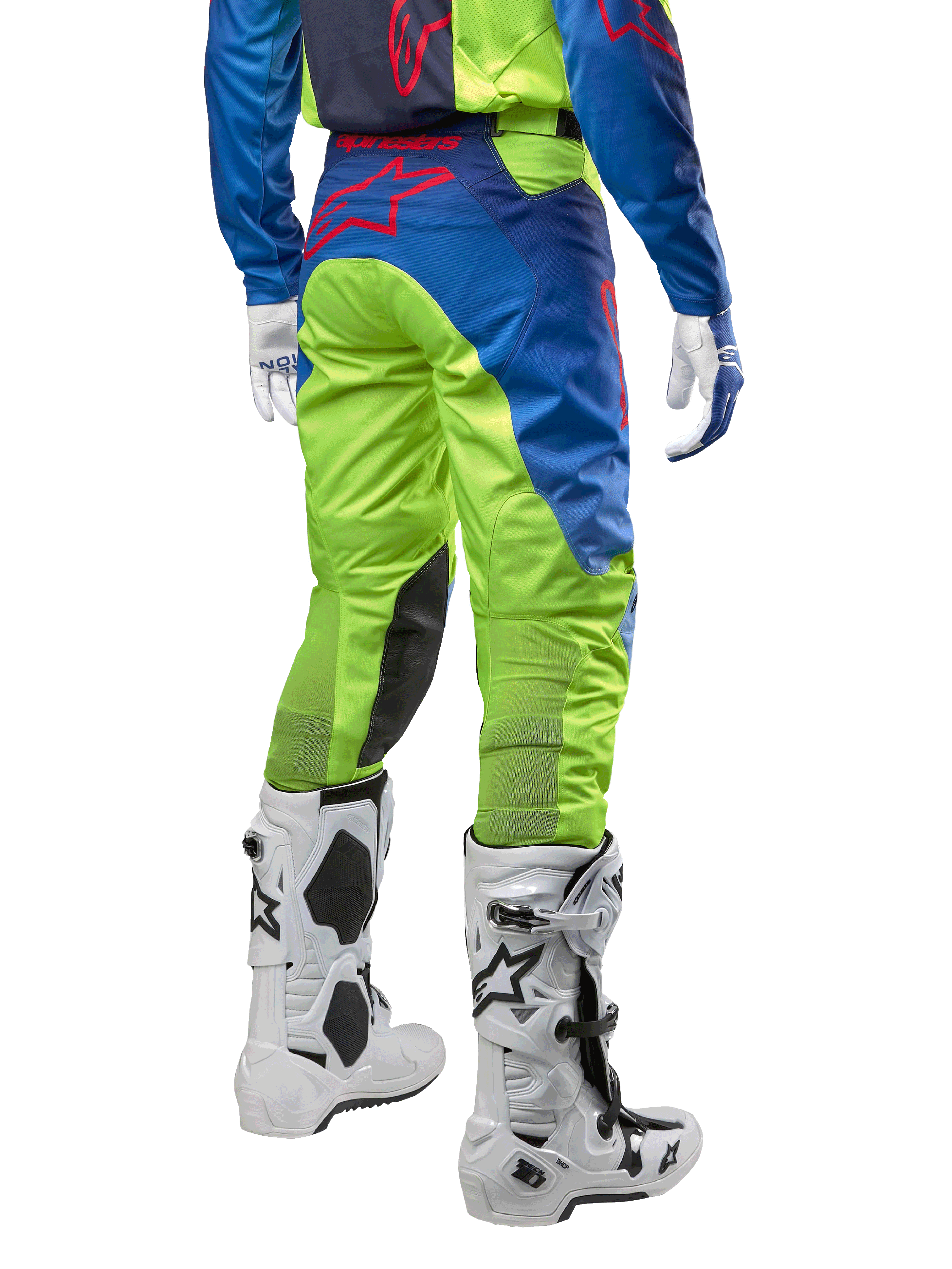 Alpinestars 2024 Racer Hoen Pants, Motocross Pants, Yellow Fluo and Blue Night Navy, back view, featuring a red Alpinestars logo, worn with matching jersey, white gloves, and white motocross boots, durable textile for off-road racing