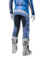 Alpinestars 2024 Techstar Pneuma Pants, Motocross Pants, Dark Navy and Light Blue, rear view featuring bold white branding on the seat and reinforced black panels, paired with white Tech 10 motocross boots.
