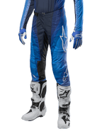 Alpinestars 2024 Techstar Pneuma Pants, Motocross Pants, Dark Navy and Light Blue, worn with matching blue jersey and white boots, featuring white logo on thigh, textured grip areas, sleek sporty design for off-road racing