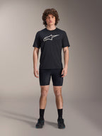 Alpinestars A-Dura Liner Shorts, Black cycling liner shorts, worn by a model with a black Alpinestars logo t-shirt and black cycling shoes, tight-fitting design for MTB performance and in-saddle comfort.