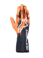 Luvas Alpinestars Tech-1 K V3, luvas de karting, preto, laranja e branco, com design gráfico sublimado de pinceladas laranja sobre base preta, logótipo Astar grande em branco, texto vertical Alpinestars no punho, equipamento profissional de karting