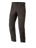 Alpinestars AST-1 V2 Waterproof Pants Long, Black Motorcycle Touring Pants, featuring zippered hip pockets and adjustable waist straps, pre-curved legs with reinforced knee panels, subtle grey logo on the shin, durable textile construction for all-weather road use