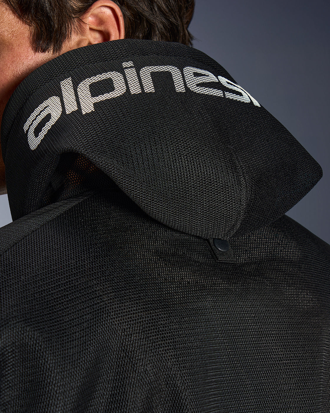 Black Alpinestars Chrome Superairflow Hoodie featuring ventilated 3D mesh and a rear snap for hood stability.