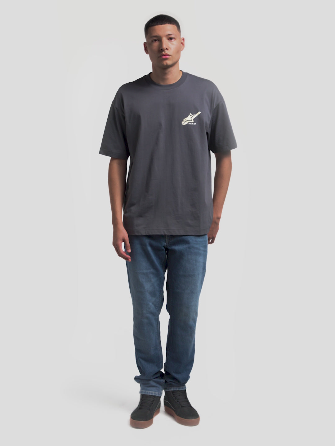 Alpinestars Ghost Oversized CSF Tee, Casual Sportswear Short Sleeve T-Shirt, Men's, Charcoal Gray, featuring a relaxed oversized silhouette with a small chest logo and a large 'Racing Ahead' graphic on the back.