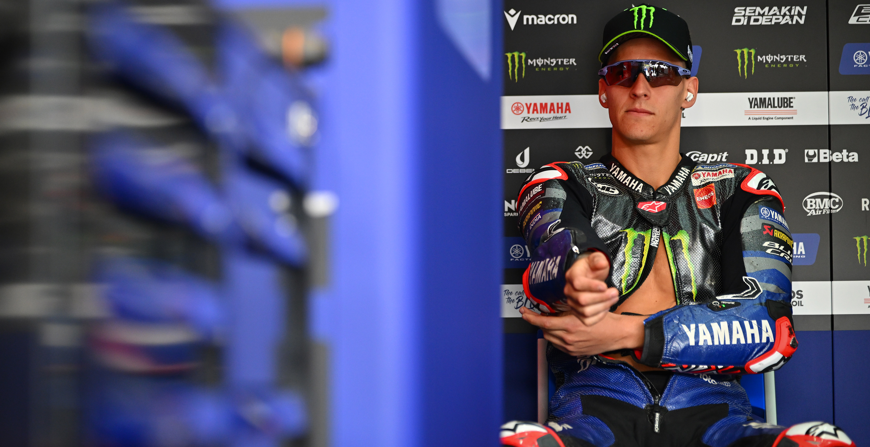 Fabio Quartararo sitting in the paddock wearing Alpinestars gear